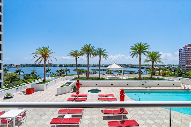view of pool with a water view