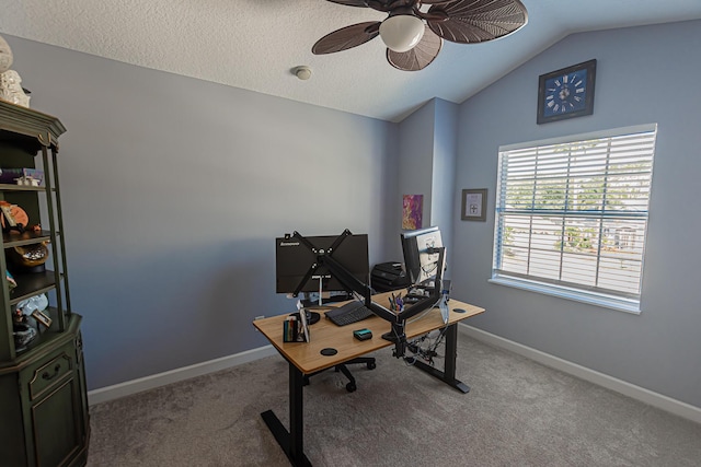 home office with baseboards, a ceiling fan, carpet flooring, and lofted ceiling
