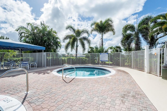 view of pool featuring fence