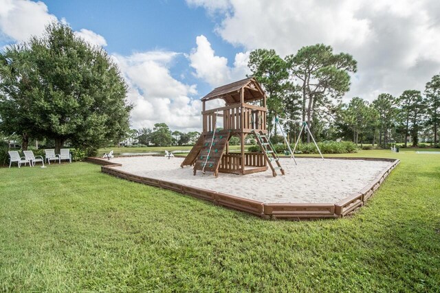 community playground featuring a lawn