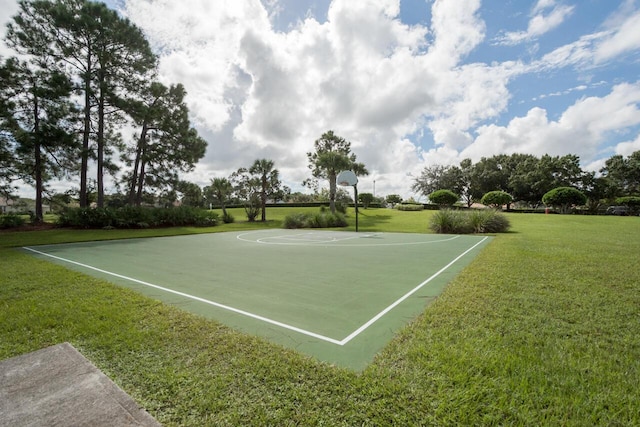 view of basketball court with a yard and community basketball court