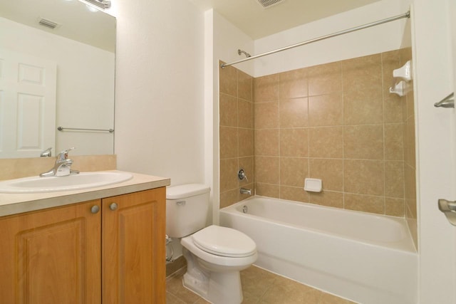 full bathroom with tile patterned flooring, visible vents, toilet, vanity, and shower / bathing tub combination