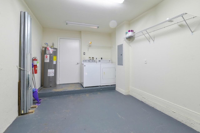 garage with baseboards, water heater, electric panel, and independent washer and dryer