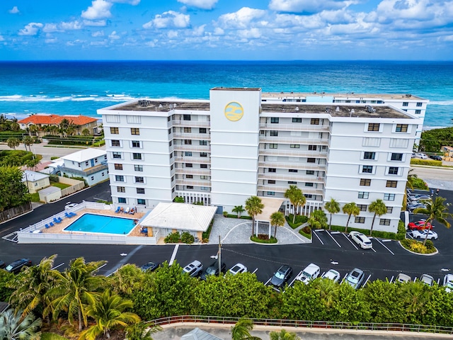 birds eye view of property with a water view