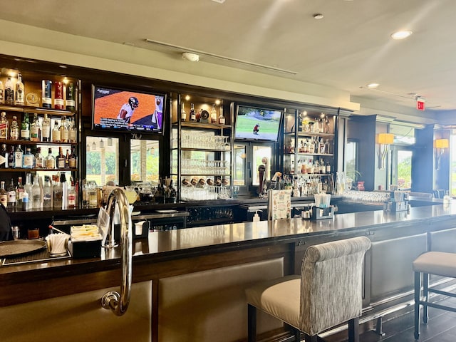 bar with recessed lighting and indoor wet bar