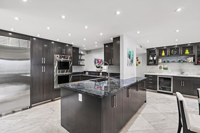 3610 S Ocean Blvd Unit 405, South Palm Beach, FL 33480 - kitchen featuring open shelves, wine cooler, light marble finish floors, a sink, and recessed lighting