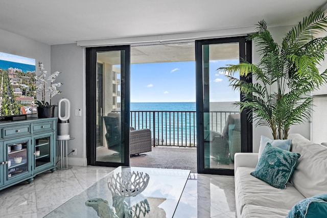 3610 S Ocean Blvd Unit 405, South Palm Beach, FL 33480 - living area featuring expansive windows, a water view, and marble finish floors