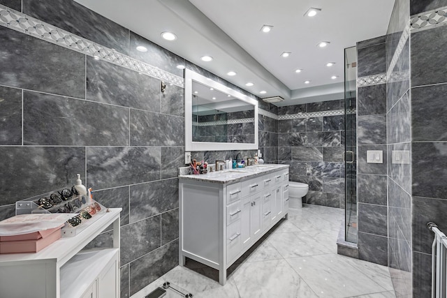 3610 S Ocean Blvd Unit 405, South Palm Beach, FL 33480 - bathroom featuring tile walls, recessed lighting, a stall shower, vanity, and marble look tiles