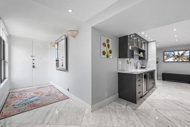 3610 S Ocean Blvd Unit 405, South Palm Beach, FL 33480 - kitchen featuring light marble finish floors, a sink, tasteful backsplash, baseboards, and recessed lighting