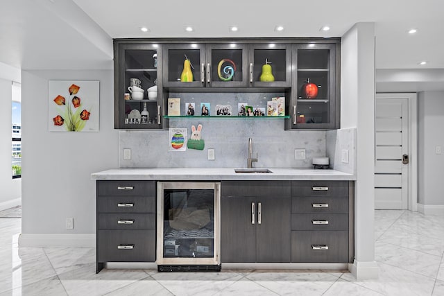 3610 S Ocean Blvd Unit 405, South Palm Beach, FL 33480 - indoor wet bar featuring beverage cooler, light marble finish floors, baseboards, decorative backsplash, and recessed lighting