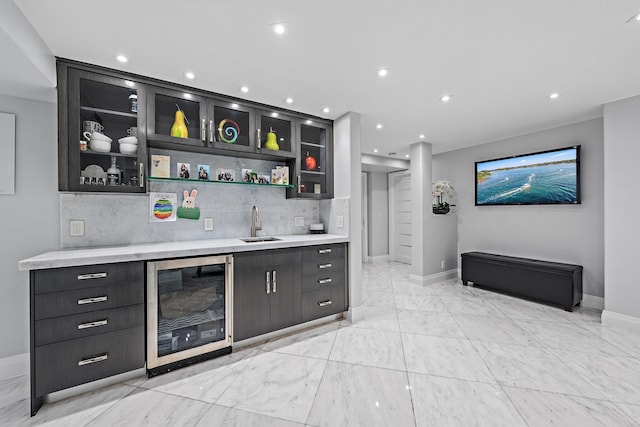 3610 S Ocean Blvd Unit 405, South Palm Beach, FL 33480 - indoor wet bar with wine cooler, baseboards, light marble finish flooring, backsplash, and recessed lighting