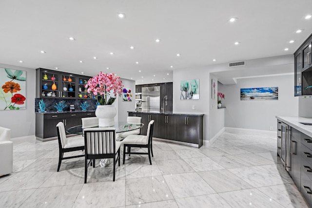 3610 S Ocean Blvd Unit 405, South Palm Beach, FL 33480 - dining area featuring baseboards, light marble finish flooring, and recessed lighting