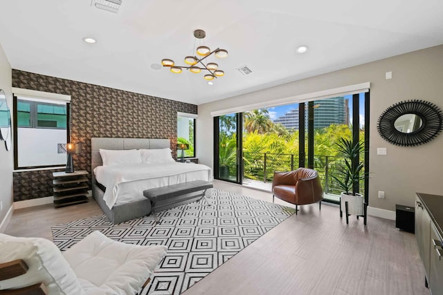 bedroom featuring visible vents, baseboards, recessed lighting, a chandelier, and wallpapered walls