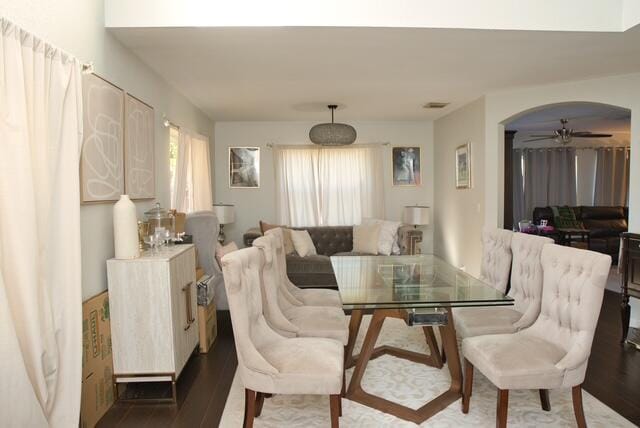 2102 Little Torch St, Riviera Beach, FL 33407 - dining room with a ceiling fan, arched walkways, and wood finished floors
