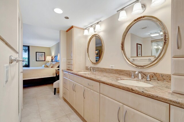 3420 S Ocean Blvd Unit 3W, Highland Beach, FL 33487 - full bathroom featuring connected bathroom, double vanity, tile patterned floors, and crown molding