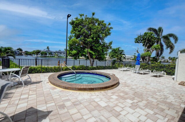 3420 S Ocean Blvd Unit 3W, Highland Beach, FL 33487 - view of pool with a community hot tub, a patio area, and a water view