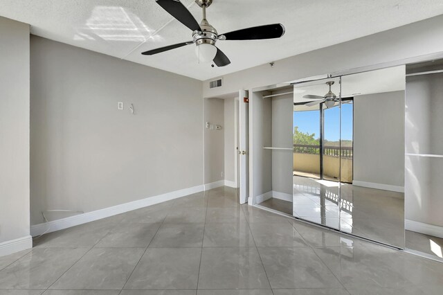 6372 La Costa Dr Unit 302, Boca Raton, FL 33433 - unfurnished room with a ceiling fan, baseboards, and tile patterned flooring