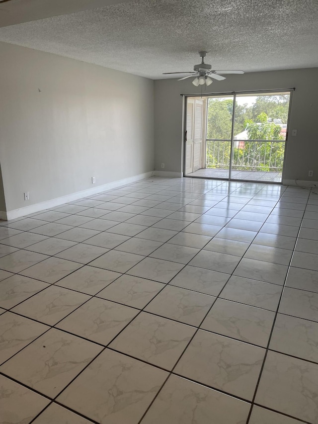 642 NW 13th St Unit 31, Boca Raton, FL 33486 - spare room featuring a textured ceiling, ceiling fan, and baseboards