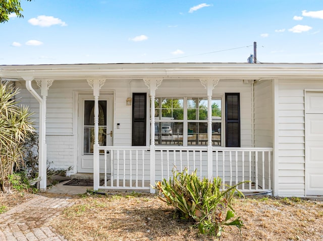 entrance to property with a porch