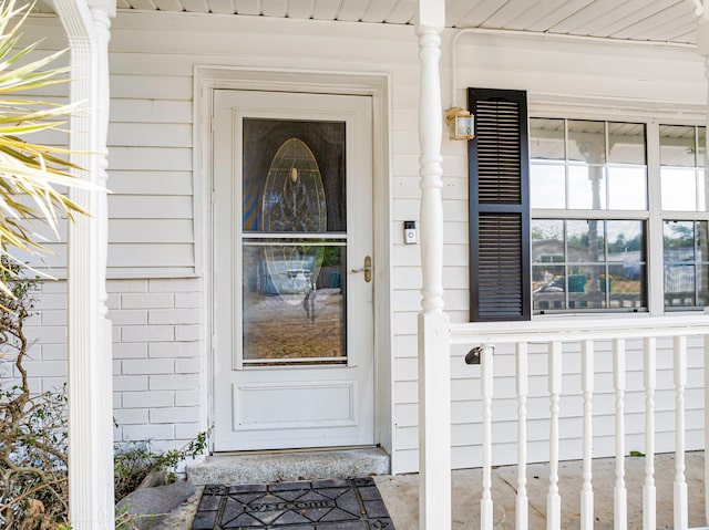 property entrance featuring covered porch