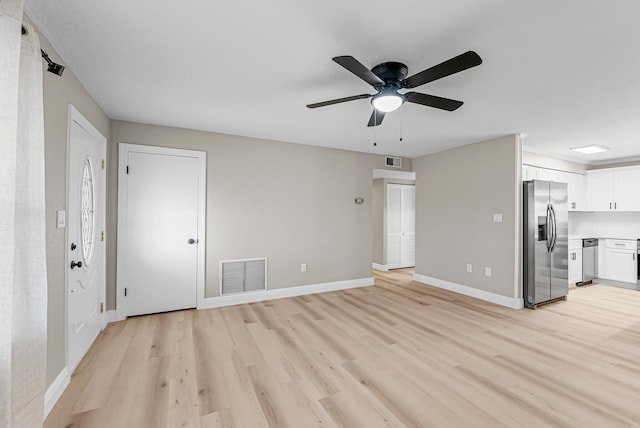 unfurnished living room featuring ceiling fan, baseboards, light wood-style floors, and visible vents