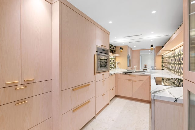 2773 S Ocean Blvd Unit 209, Palm Beach, FL 33480 - kitchen featuring a peninsula, oven, light brown cabinets, light stone countertops, and recessed lighting