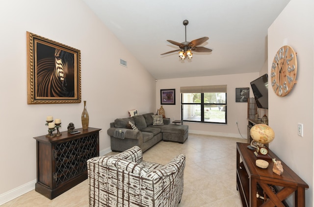 living room with lofted ceiling, a ceiling fan, baseboards, and light tile patterned floors