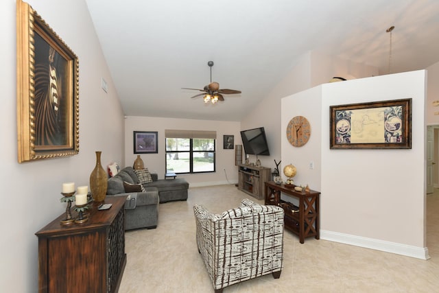 living area with lofted ceiling, ceiling fan, baseboards, and light tile patterned floors