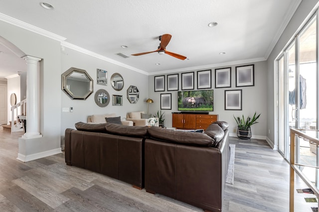 8533 Briar Rose Pt, Boynton Beach, FL 33473 - living room with ornate columns, ceiling fan, baseboards, light wood-type flooring, and crown molding