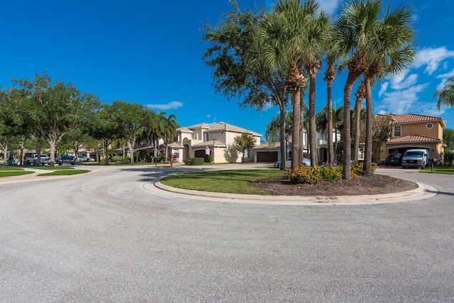8533 Briar Rose Pt, Boynton Beach, FL 33473 - view of front of house with curved driveway, stucco siding, and a tiled roof