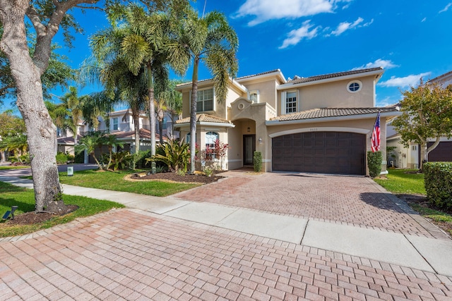 8533 Briar Rose Pt, Boynton Beach, FL 33473 - mediterranean / spanish home with stucco siding, decorative driveway, and a tiled roof