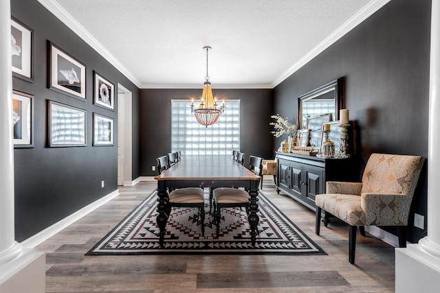 8533 Briar Rose Pt, Boynton Beach, FL 33473 - dining area featuring a chandelier, ornamental molding, wood finished floors, and baseboards