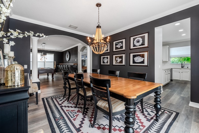 8533 Briar Rose Pt, Boynton Beach, FL 33473 - dining room with arched walkways, wood finished floors, a chandelier, and ornamental molding