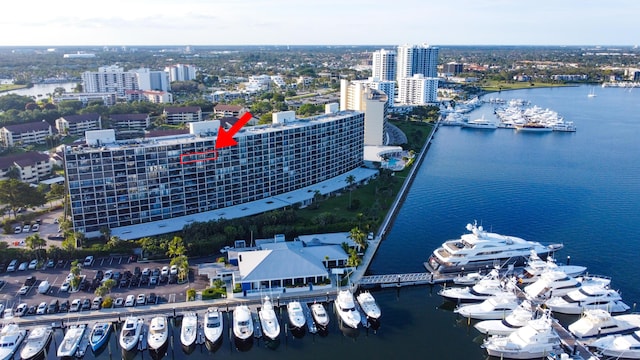 birds eye view of property featuring a city view and a water view