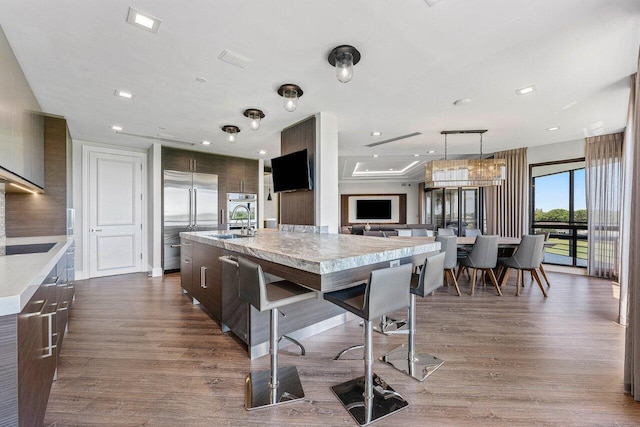 7383 Orangewood Ln Unit 304, Boca Raton, FL 33433 - kitchen featuring stainless steel appliances, modern cabinets, light countertops, dark wood-style flooring, and recessed lighting