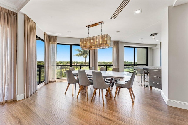 7383 Orangewood Ln Unit 304, Boca Raton, FL 33433 - dining room with wood finished floors and baseboards