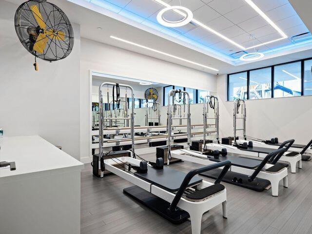7383 Orangewood Ln Unit 304, Boca Raton, FL 33433 - workout area featuring wood finished floors