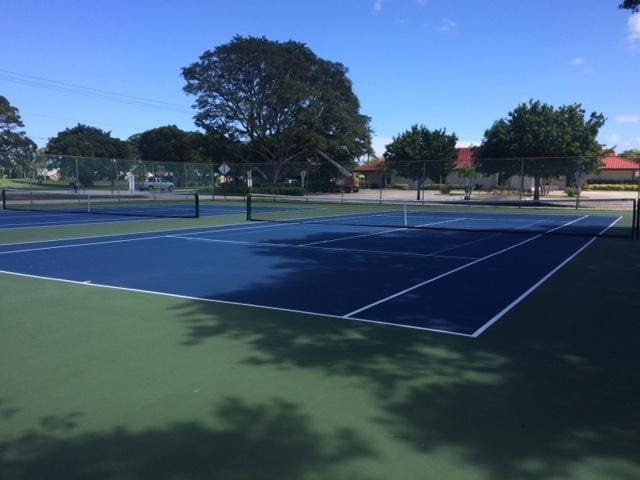 829 Camino Rd Unit 112-B, Delray Beach, FL 33445 - view of tennis court featuring fence