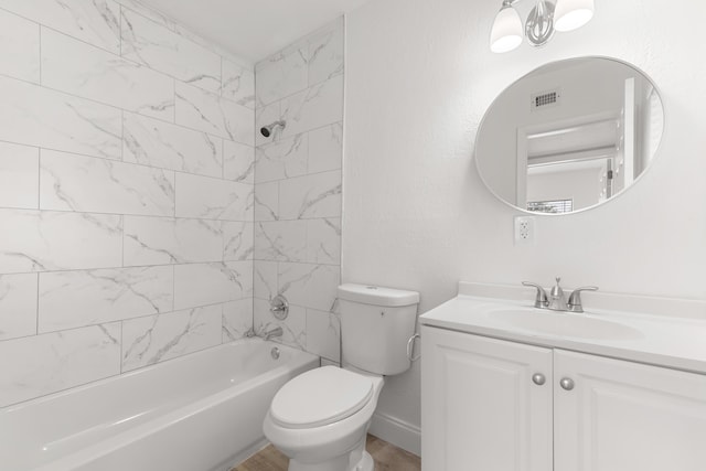 bathroom featuring toilet, bathtub / shower combination, visible vents, wood finished floors, and vanity