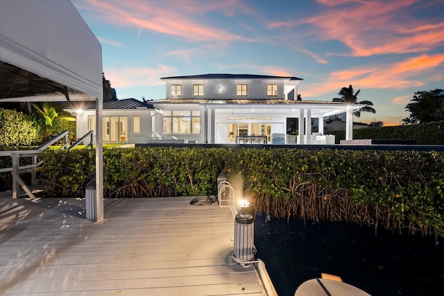 1304 Peninsular Rd, Jupiter, FL 33469 - rear view of property featuring a standing seam roof, a deck, and metal roof