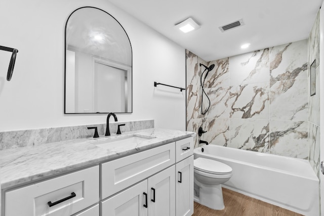 7350 Kinghurst Dr Unit 305, Delray Beach, FL 33446 - full bathroom featuring wood finished floors, visible vents, shower / bath combination, vanity, and toilet