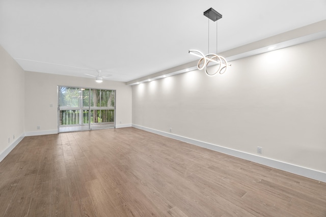 7350 Kinghurst Dr Unit 305, Delray Beach, FL 33446 - unfurnished living room with light wood-type flooring, baseboards, and ceiling fan