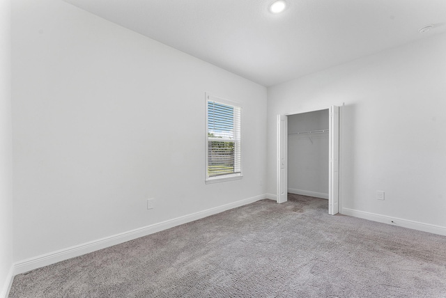 2132 SW Vista Rd, Port Saint Lucie, FL 34953 - unfurnished bedroom with a closet, baseboards, and carpet floors