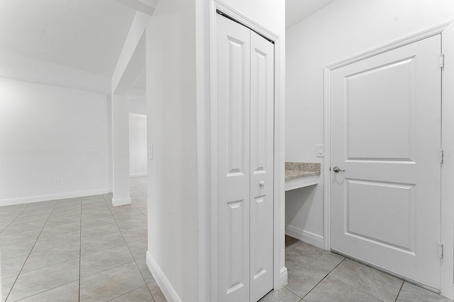 2132 SW Vista Rd, Port Saint Lucie, FL 34953 - corridor with light tile patterned floors and baseboards