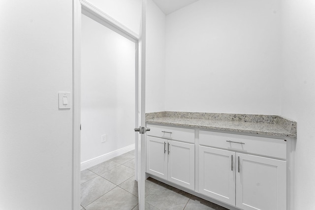 2132 SW Vista Rd, Port Saint Lucie, FL 34953 - bathroom featuring tile patterned floors and baseboards