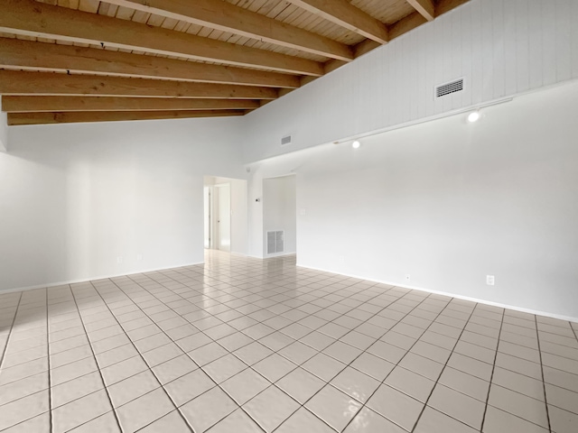 unfurnished room with light tile patterned floors, visible vents, wooden ceiling, and beam ceiling