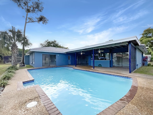 pool featuring a ceiling fan and a patio area