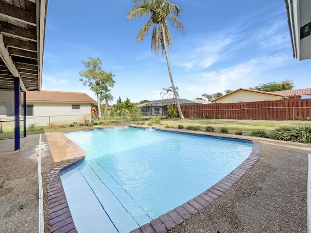 view of swimming pool with fence and a fenced in pool