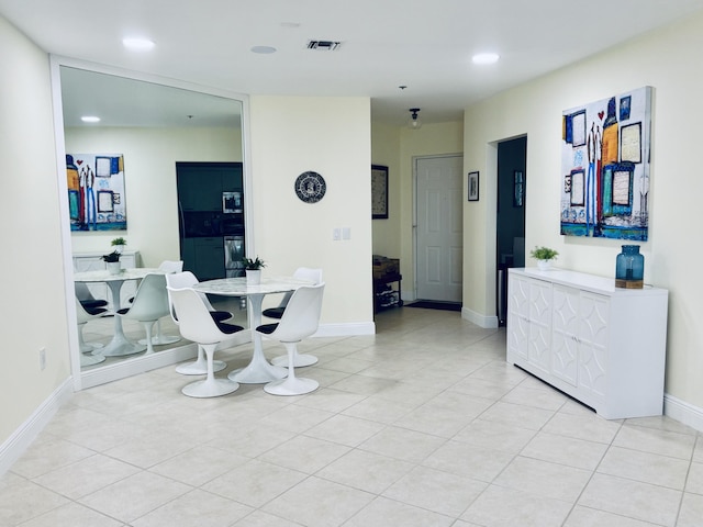 dining area with light tile patterned flooring, visible vents, recessed lighting, and baseboards