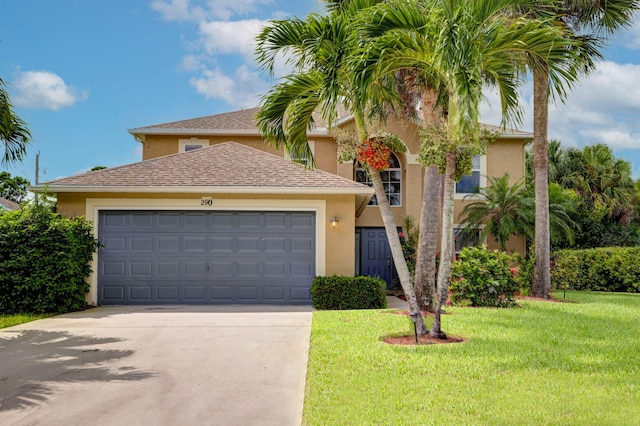 view of front of house featuring stucco siding, driveway, a front lawn, and a garage